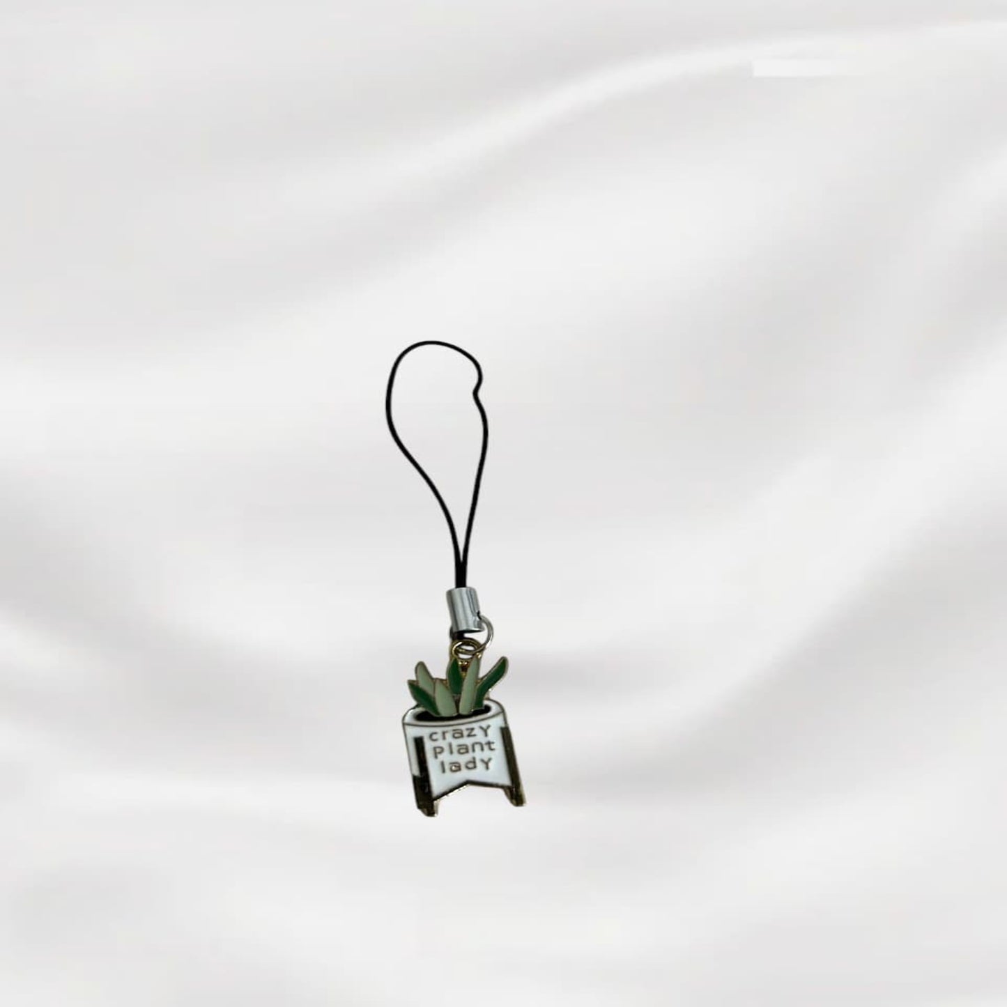 Phone charm with a plant design and 'plant lady' text on a white background