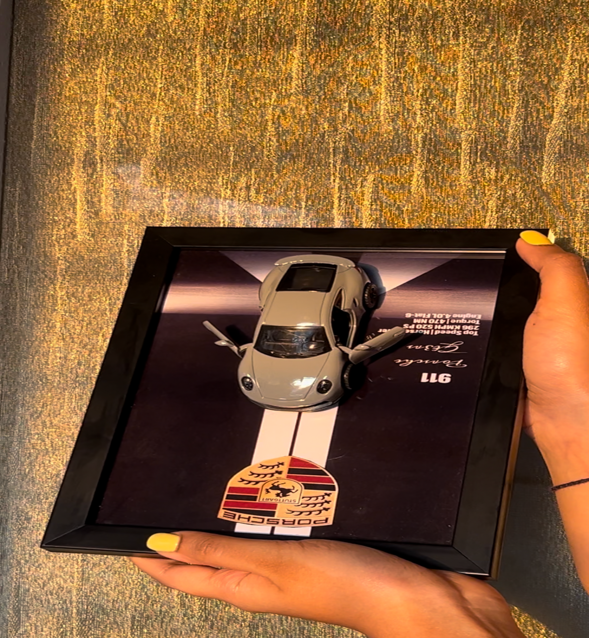Car keychain in a box with a blurred background
