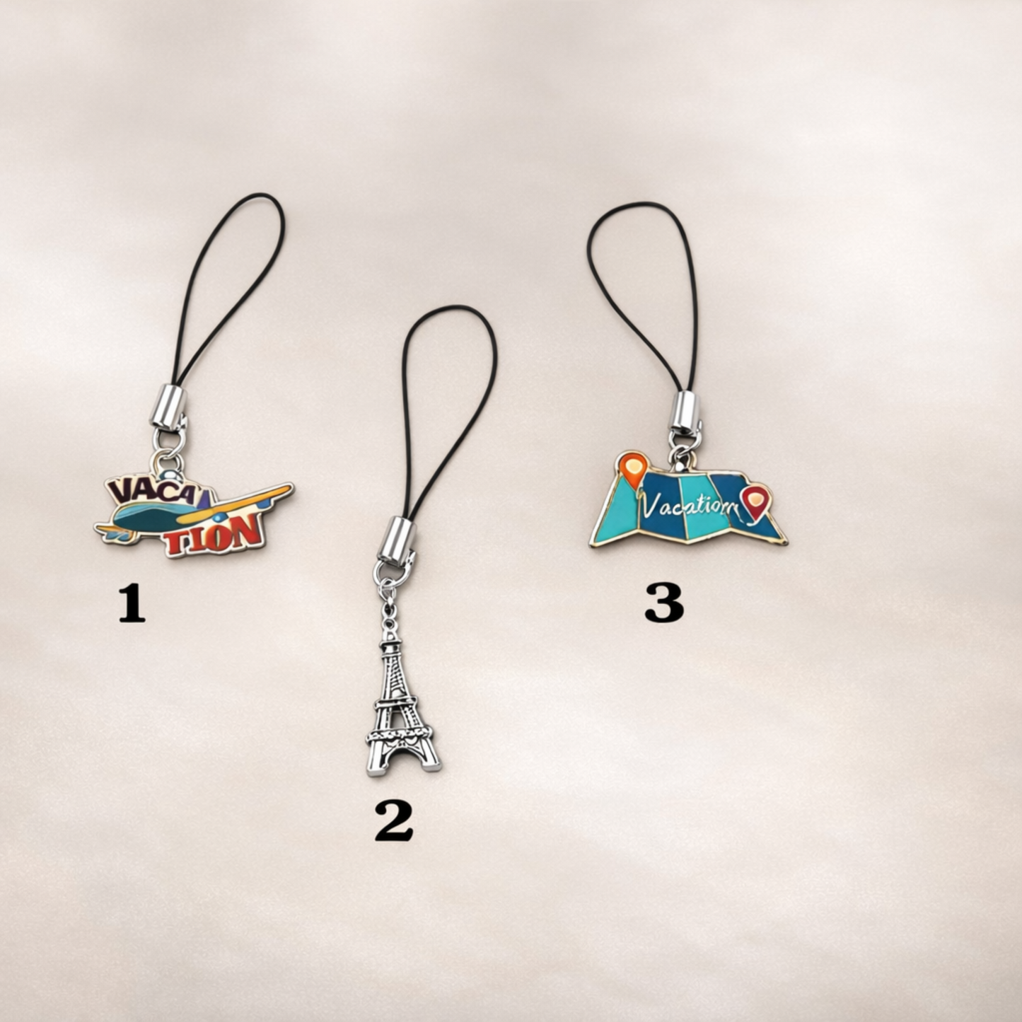 Three phone charm options with different designs on a beige background