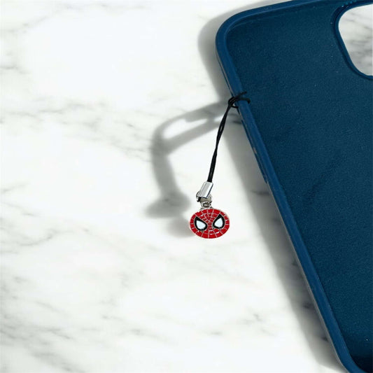 Phone charm with Spider-Man design on a blue phone case against a white marble background - Thecharmingcharms09